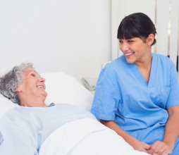 senior woman and nurse talking each other