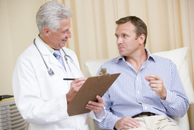 doctor and young male talking